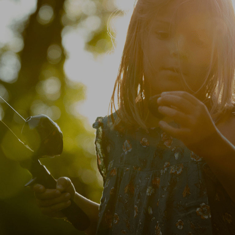 Little girl holding fishing rod