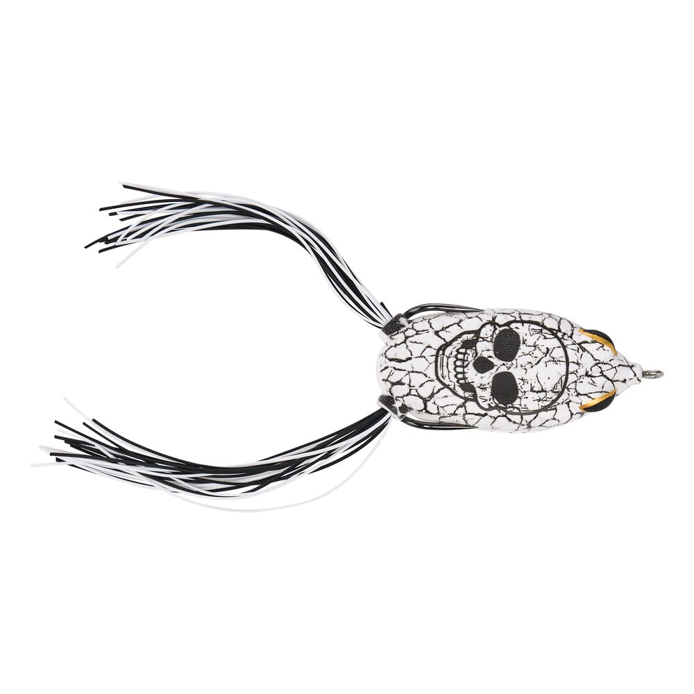 A fishing lure with a silver and black skull design on a white cracked-ice patterned body, featuring black and white skirt strands and gold eye accents, shown against a plain white background.