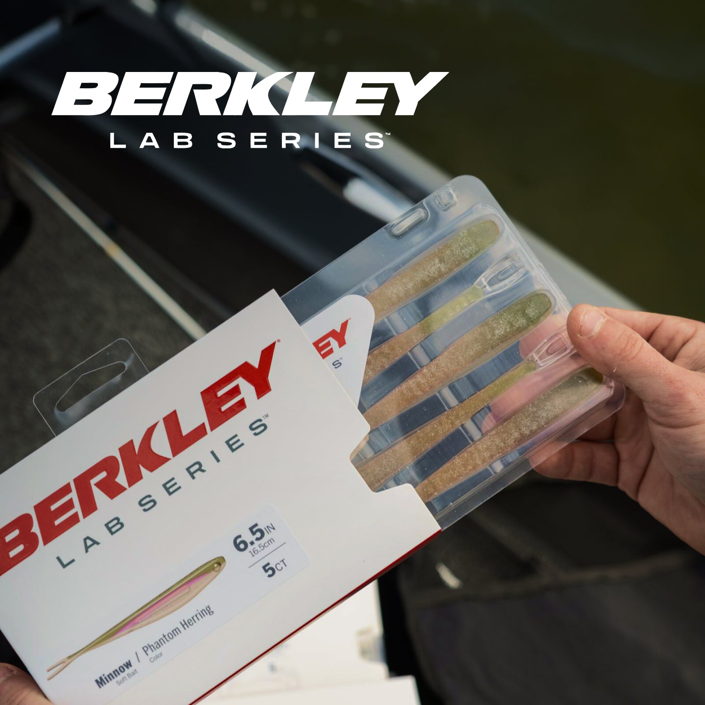Berkley Lab Series fishing lures in packaging held by a person with blurred background